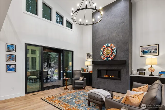 a living room with furniture a table and a fireplace