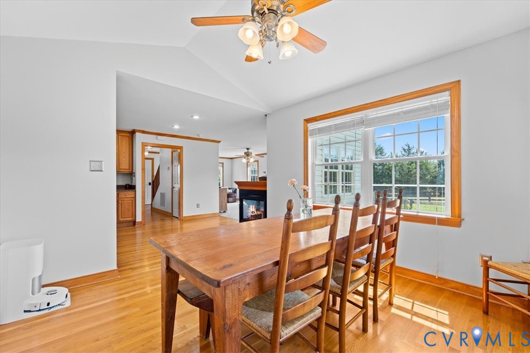 3137 Trenholm Road Powhatan, VA 23139 - Photo 16 of 72 a view of a dining room with furniture window and wooden floor