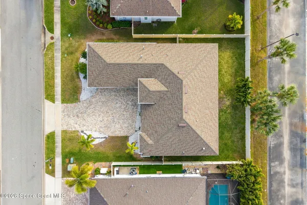 an aerial view of residential houses with outdoor space