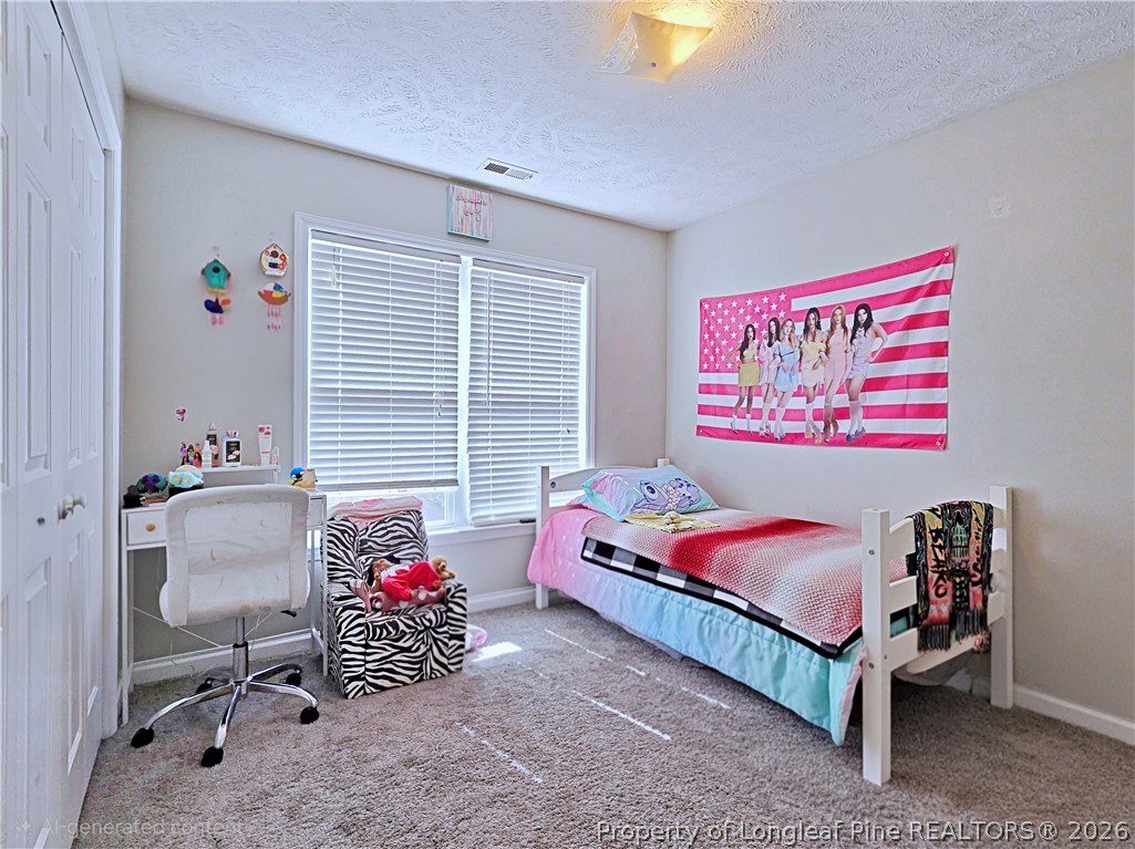 5218 Pringle Way Hope Mills, NC 28348 - Photo 27 of 43 a bedroom with a bed and a window