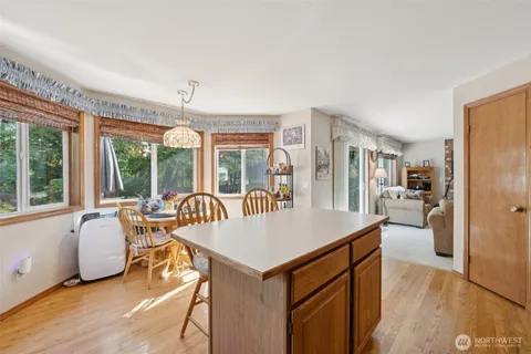 a living room with furniture a window and appliances