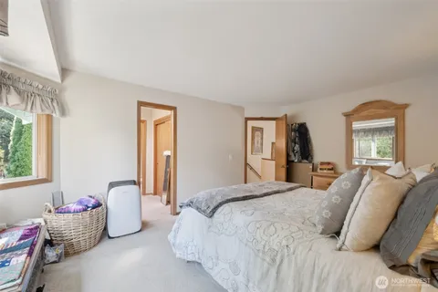 a bedroom with a bed and a lamp