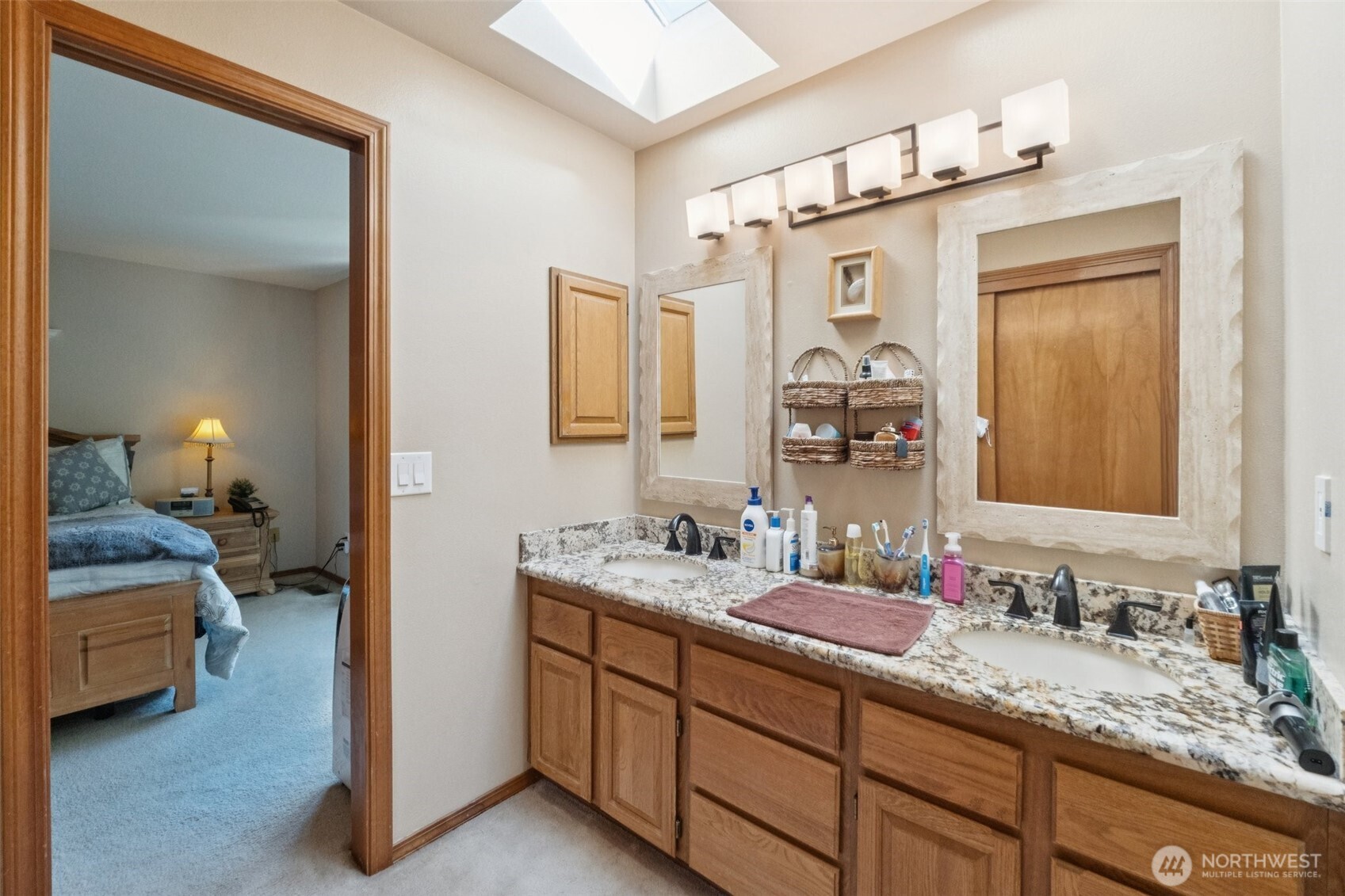 28820 52nd Place South Auburn, WA 98001 - Photo 22 of 33 a en suite bathroom with a double vanity sink and a mirror