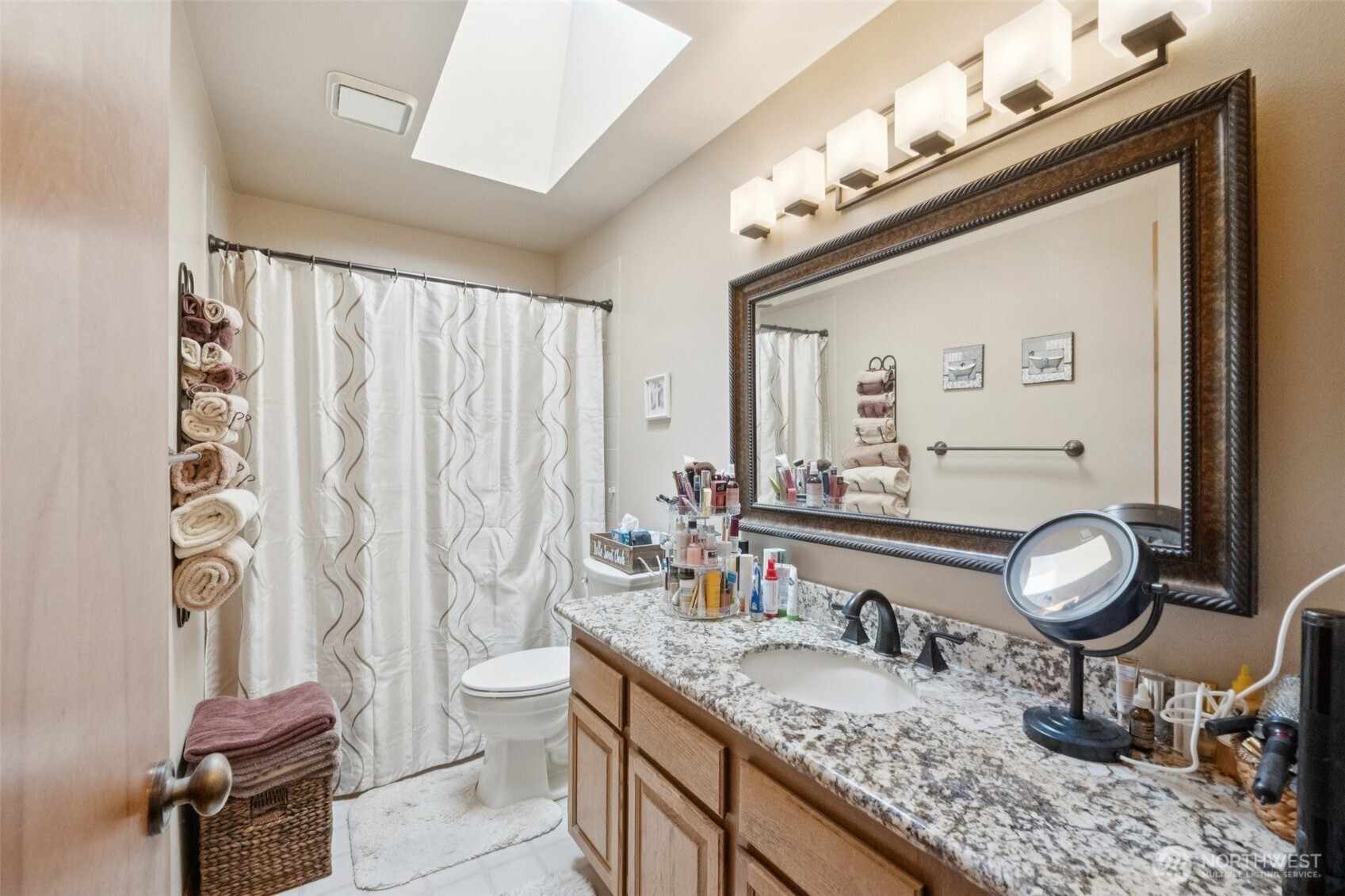 28820 52nd Place South Auburn, WA 98001 - Photo 24 of 33 a bathroom with a granite countertop sink a toilet and a mirror