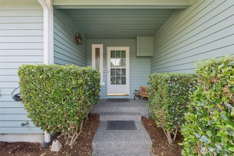 a front view of a house with garden