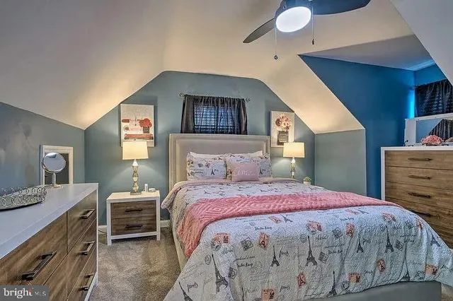 a bedroom with a bed and a dresser