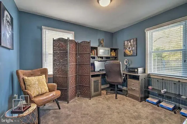 a workspace with furniture and a window