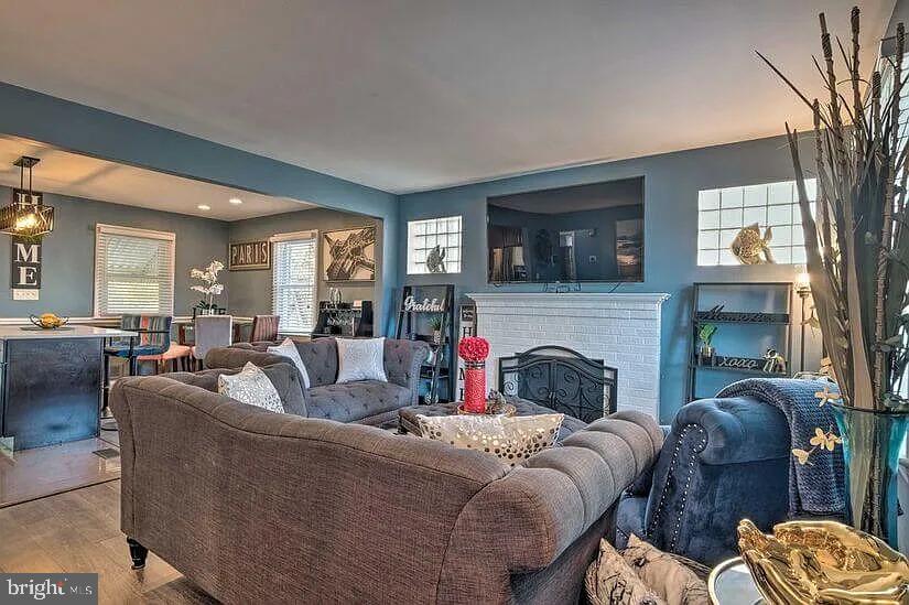 4617 Boosa Street, Unit 1 Capitol Heights, MD 20743 - Photo 7 of 19 a living room with furniture and a fireplace
