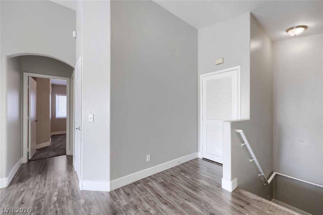 5985 High Steed Street, Unit 101 Henderson, NV 89011 - Photo 4 of 38 An inviting entry space features durable plank flooring and a discreetly integrated staircase.