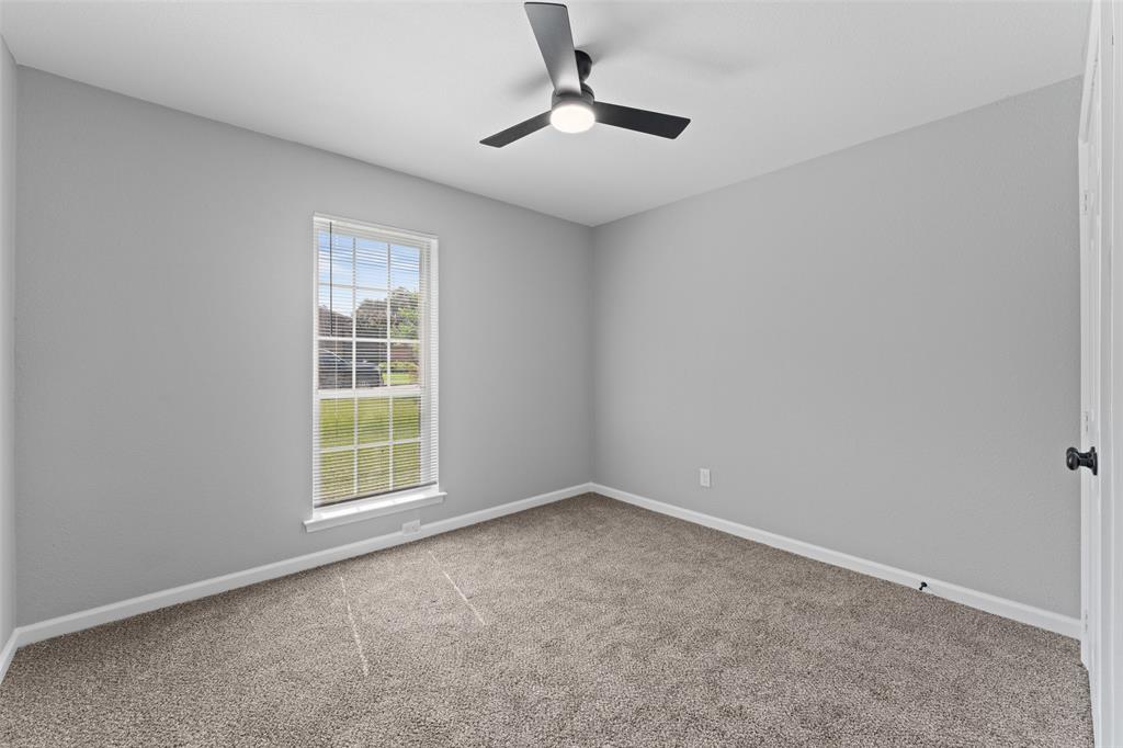 1137 Via Balboa Mesquite, TX 75150 - Photo 11 of 15 Empty room with carpet floors and ceiling fan