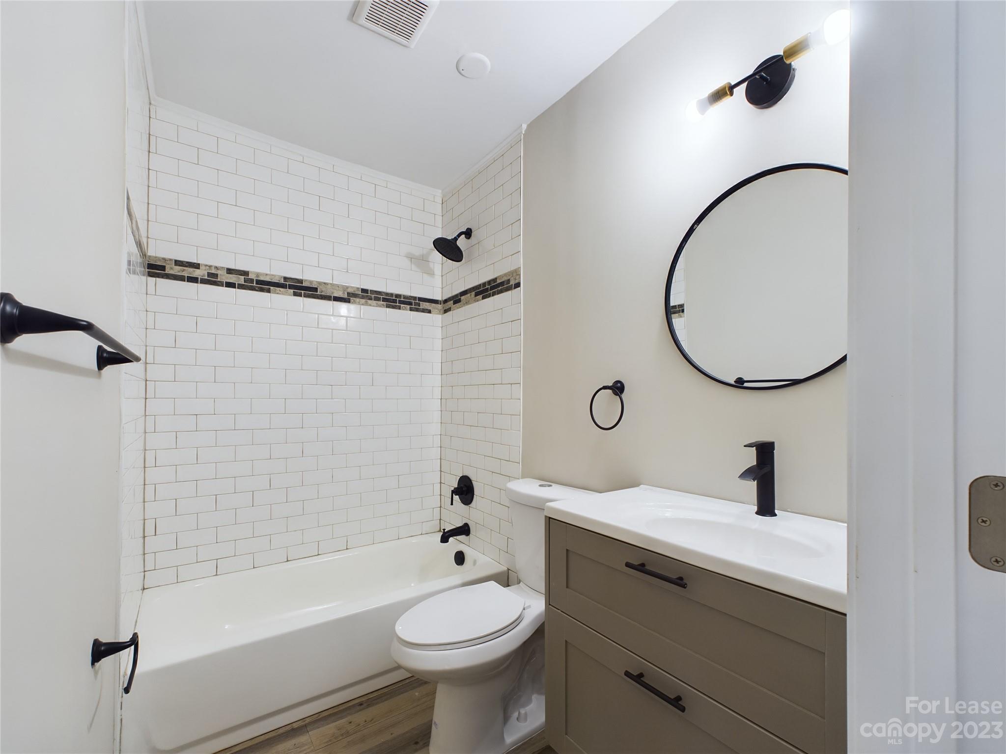 503 5th Street Southwest, Unit 2 Hickory, NC 28602 - Photo 9 of 11 a bathroom with a sink toilet and shower