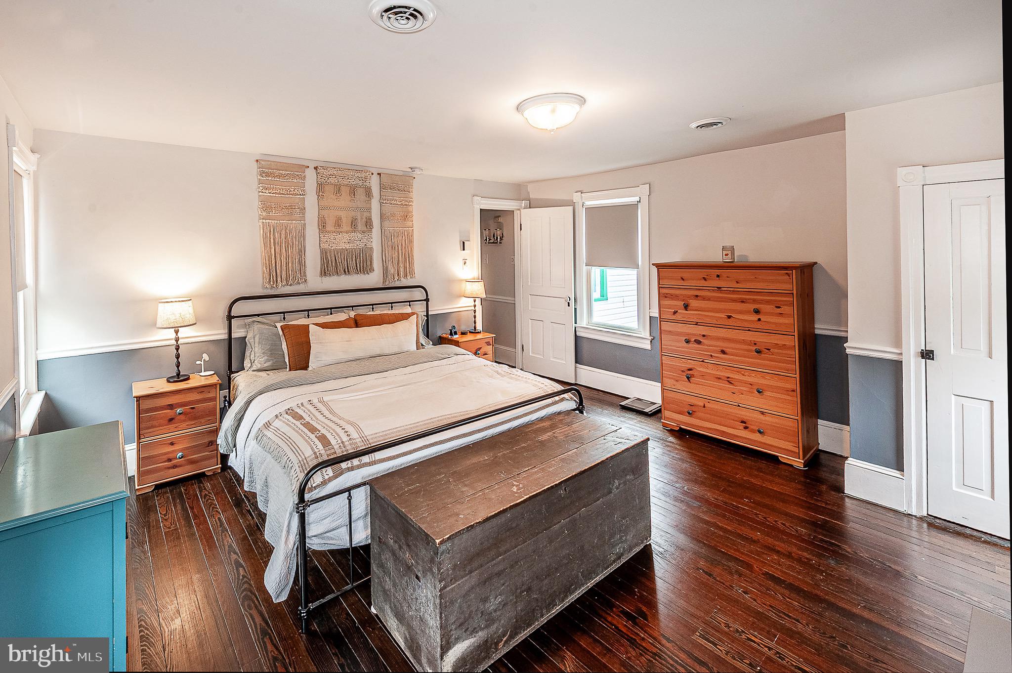 584 Clems Run Mullica Hill, NJ 08062 - Photo 15 of 23 a bedroom with a bed and wooden floor