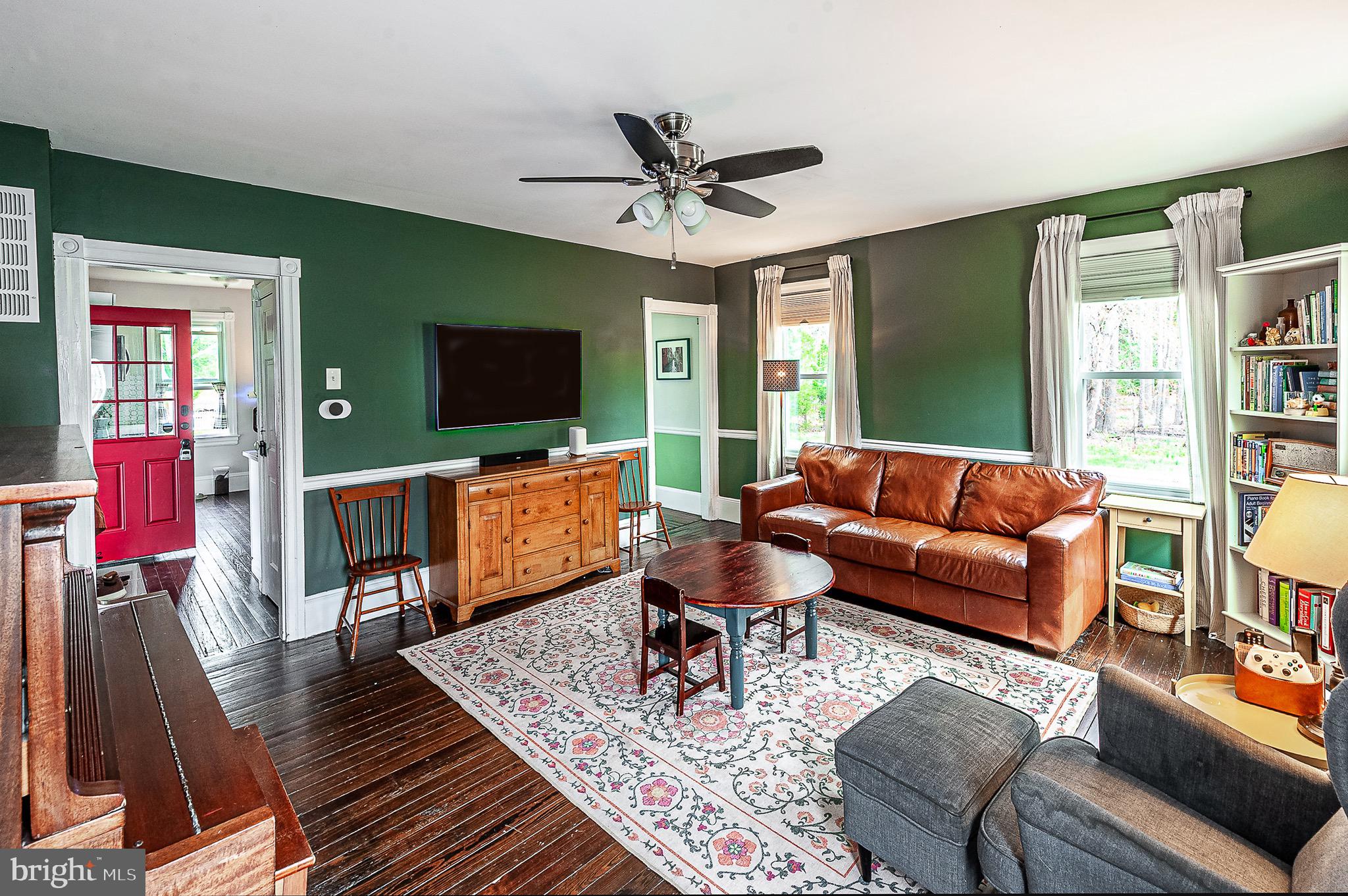 584 Clems Run Mullica Hill, NJ 08062 - Photo 6 of 23 a living room with furniture and a flat screen tv