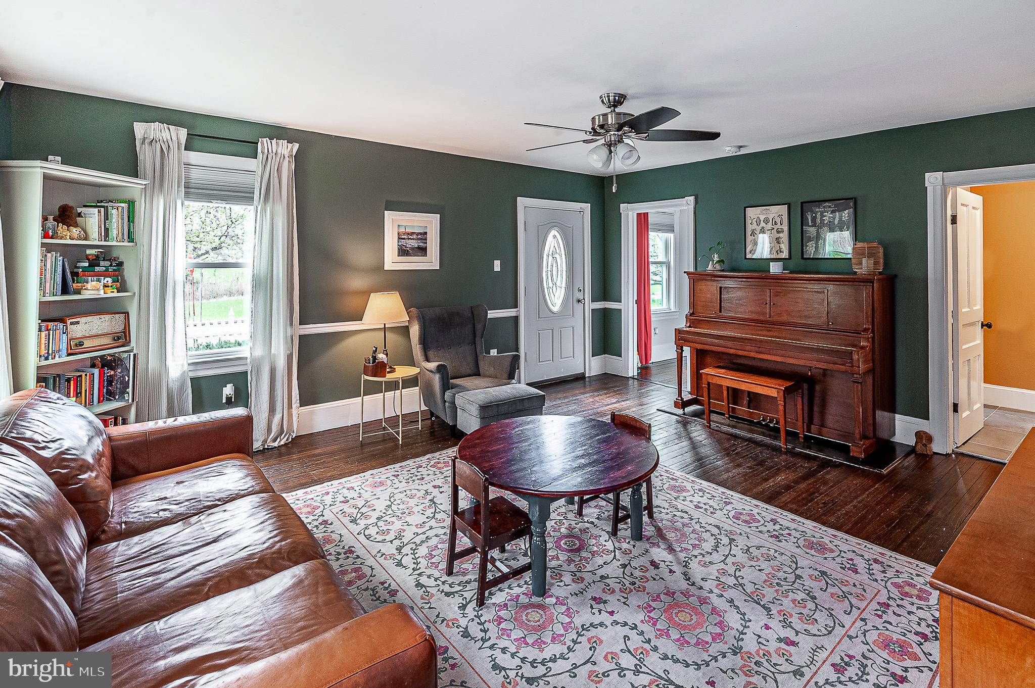 584 Clems Run Mullica Hill, NJ 08062 - Photo 7 of 23 a living room with furniture and a fireplace