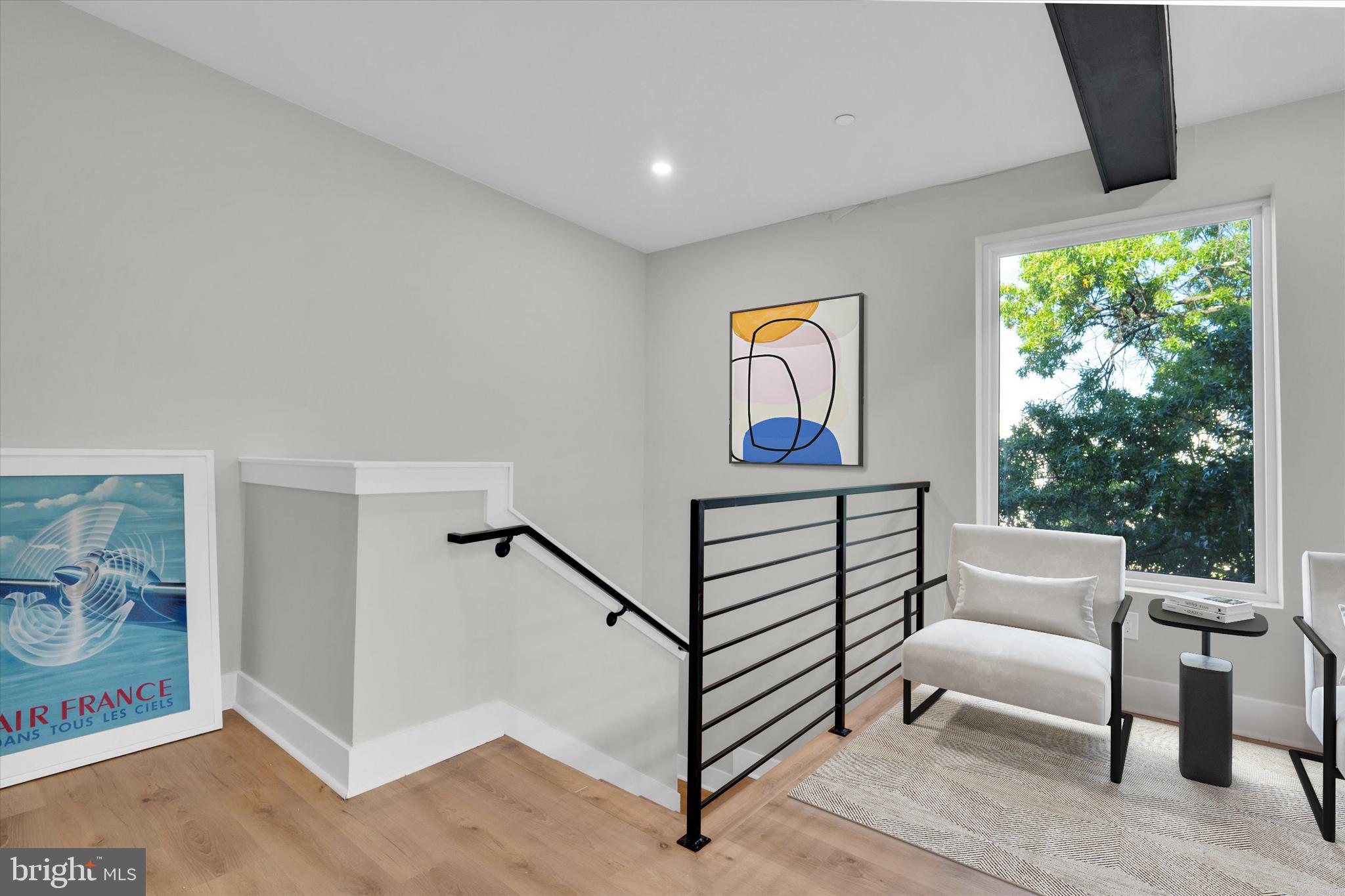 1915 Benning Road Northeast, Unit 9 401 Washington, DC 20002 - Photo 3 of 19 a living room with furniture and a window
