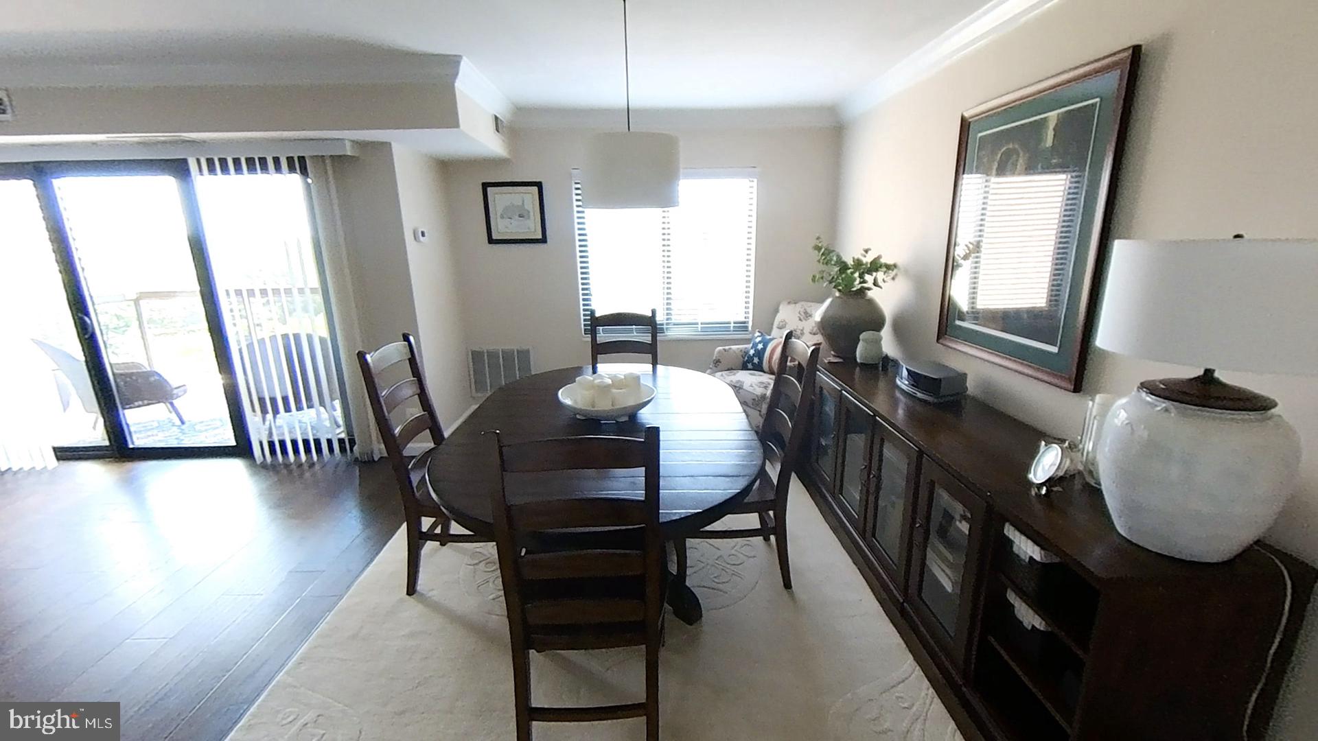 1915 Benning Road Northeast, Unit 9 401 Washington, DC 20002 - Photo 8 of 19 a view of a dining room with furniture and a potted plant