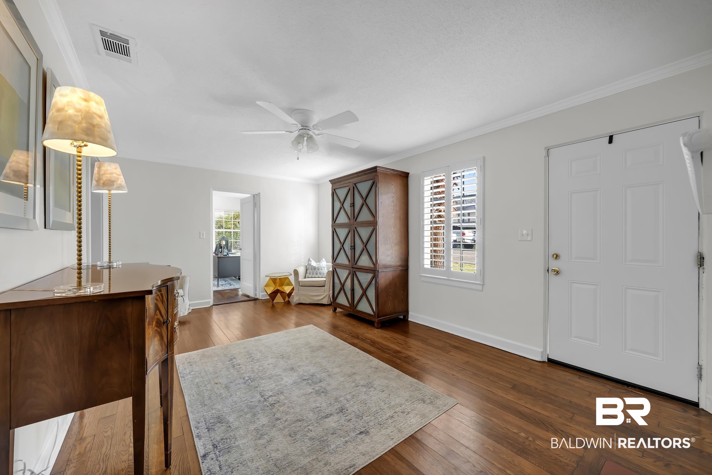 18 York Place Mobile, AL 36608 - Photo 7 of 27 Foyer featuring crown molding, dark wood-style flooring, and ceiling fan