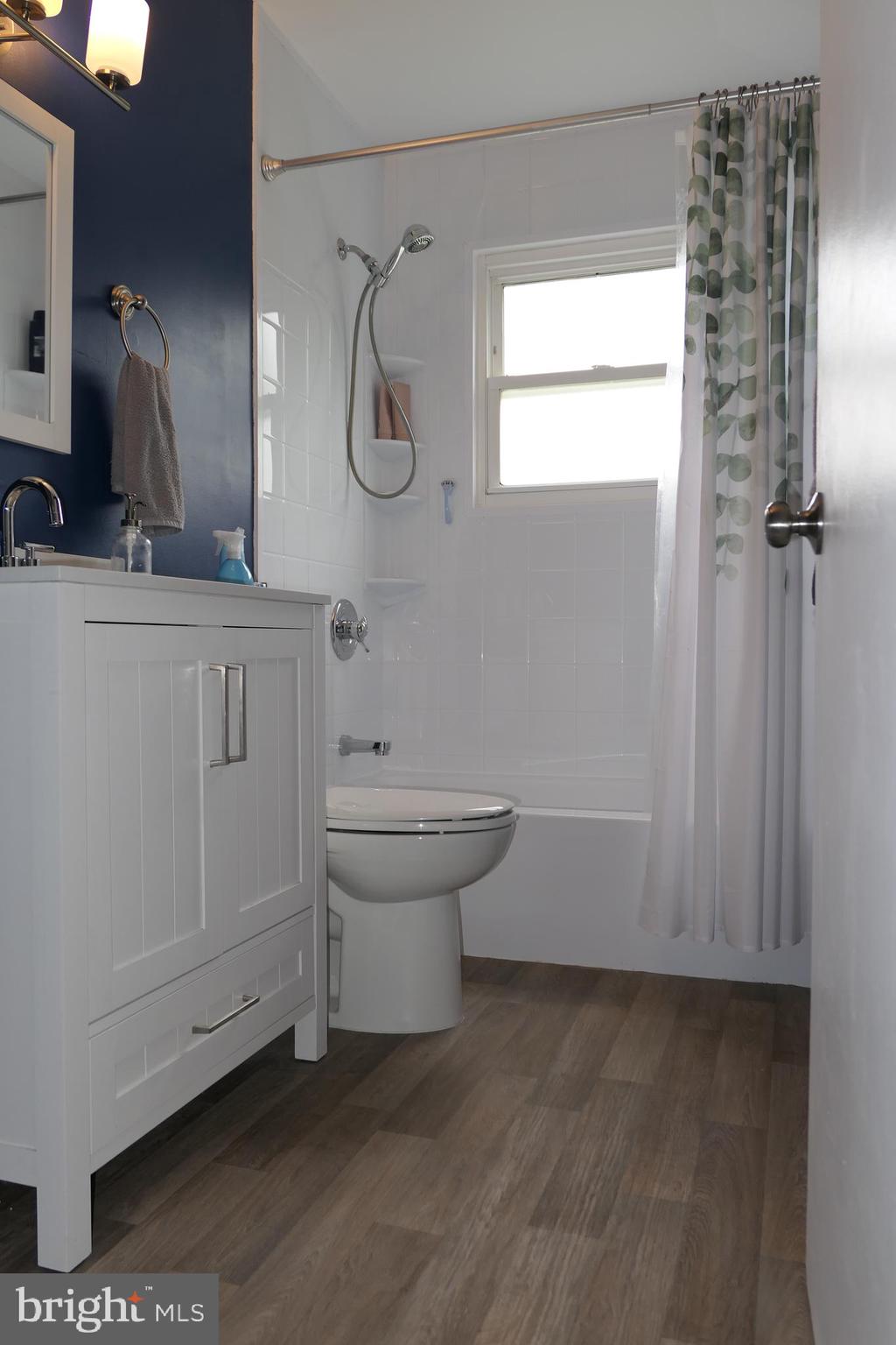 206 Stanlake Road Owings Mills, MD 21117 - Photo 22 of 31 a bathroom with a sink and a mirror