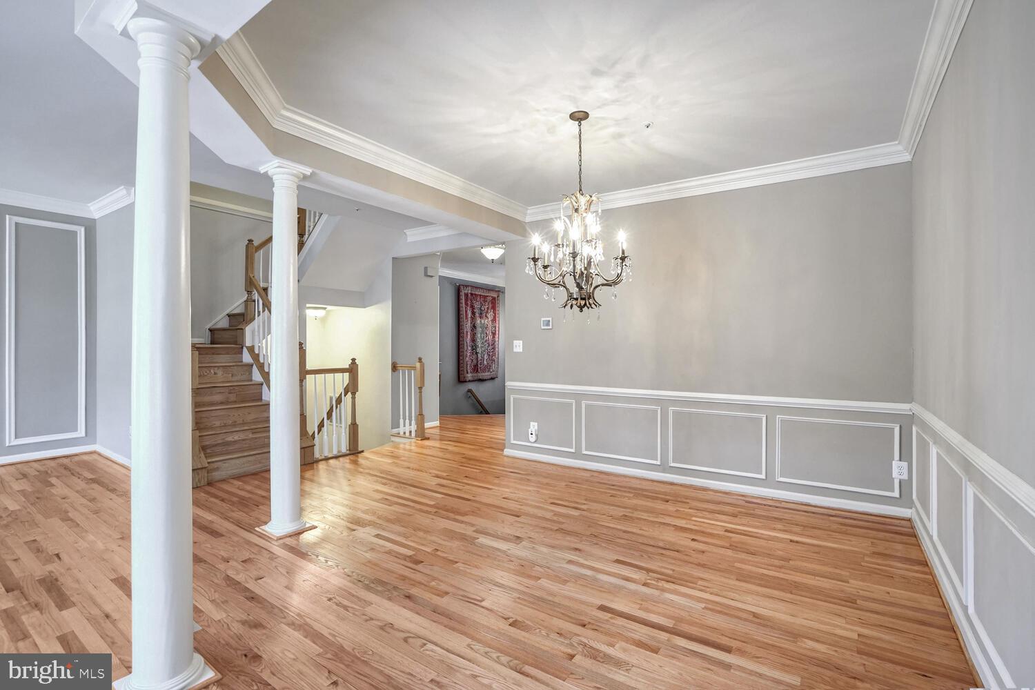 1794 Dawson Street Vienna, VA 22182 - Photo 12 of 30 a view of a livingroom with wooden floor a chandelier and entryway