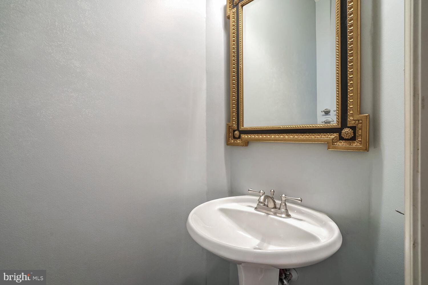 1794 Dawson Street Vienna, VA 22182 - Photo 13 of 30 a bathroom with a sink and a mirror