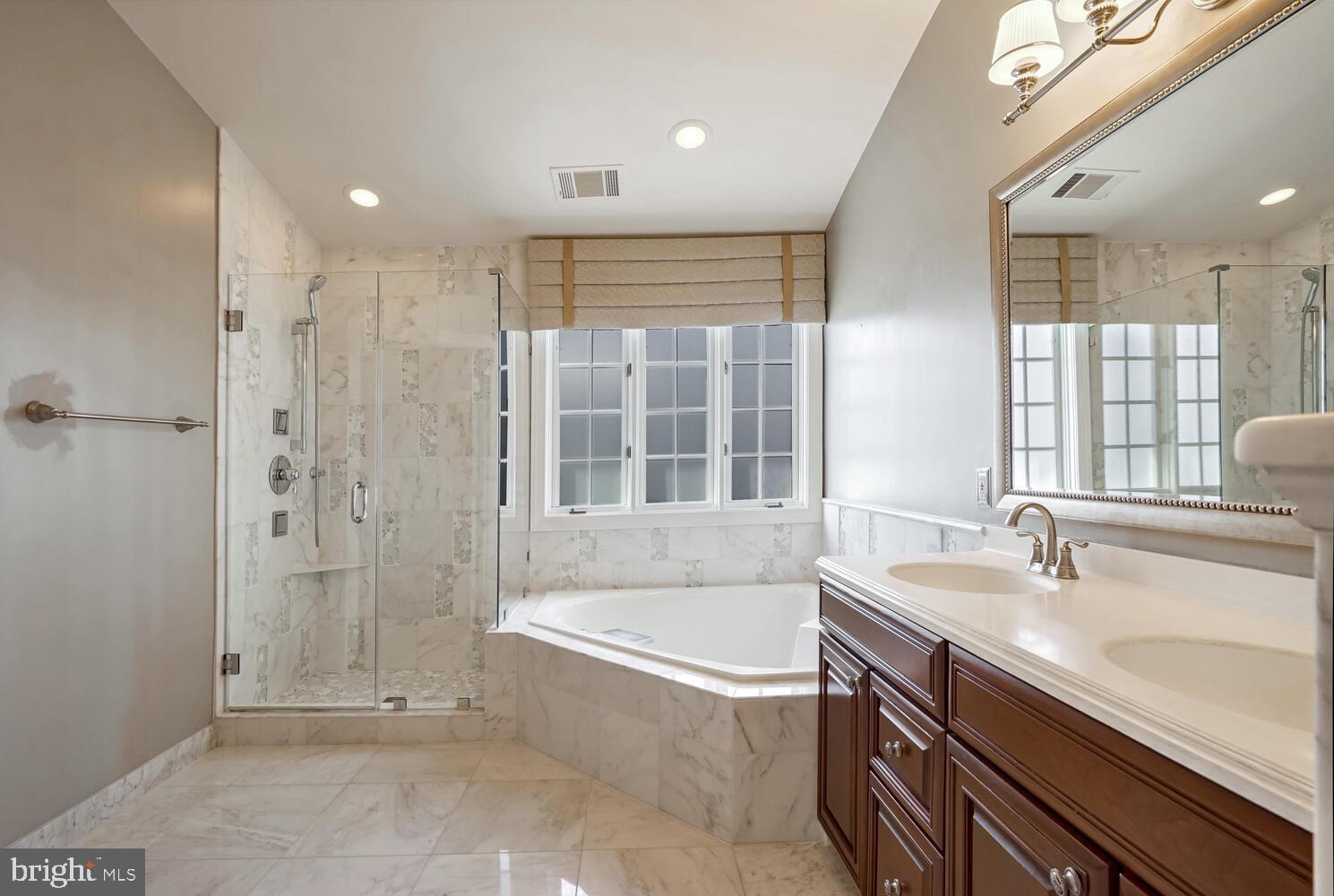 1794 Dawson Street Vienna, VA 22182 - Photo 17 of 30 a bathroom with a bathtub and a sink