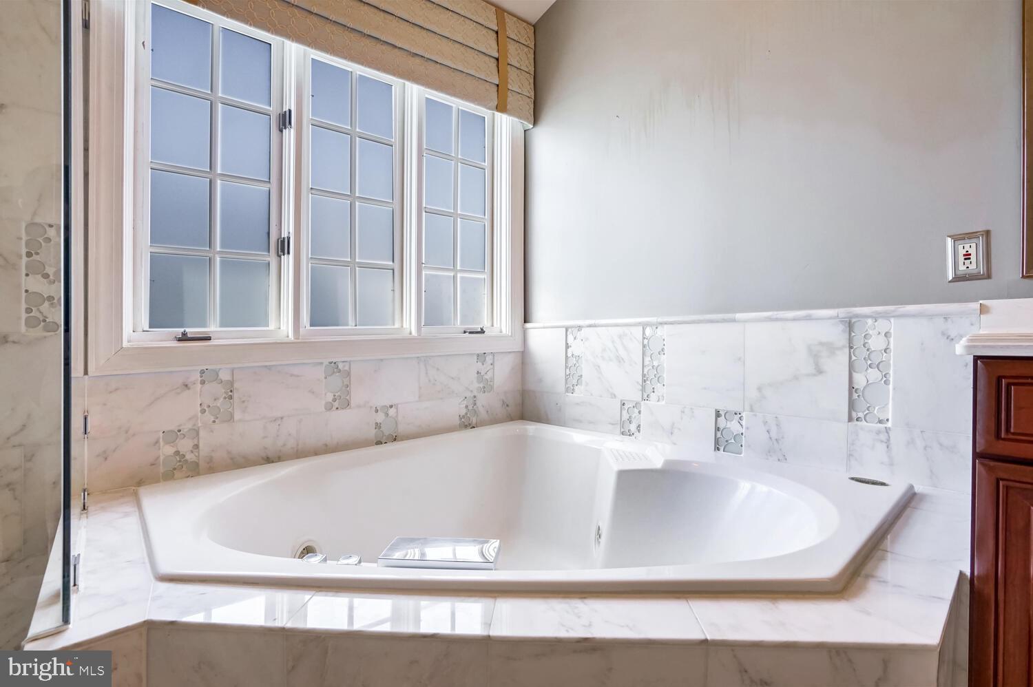 1794 Dawson Street Vienna, VA 22182 - Photo 18 of 30 a white bath tub sitting next to a window