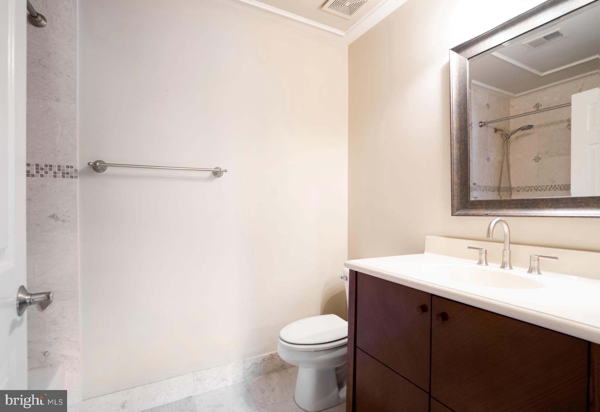 1794 Dawson Street Vienna, VA 22182 - Photo 22 of 30 a bathroom with a sink vanity mirror and toilet