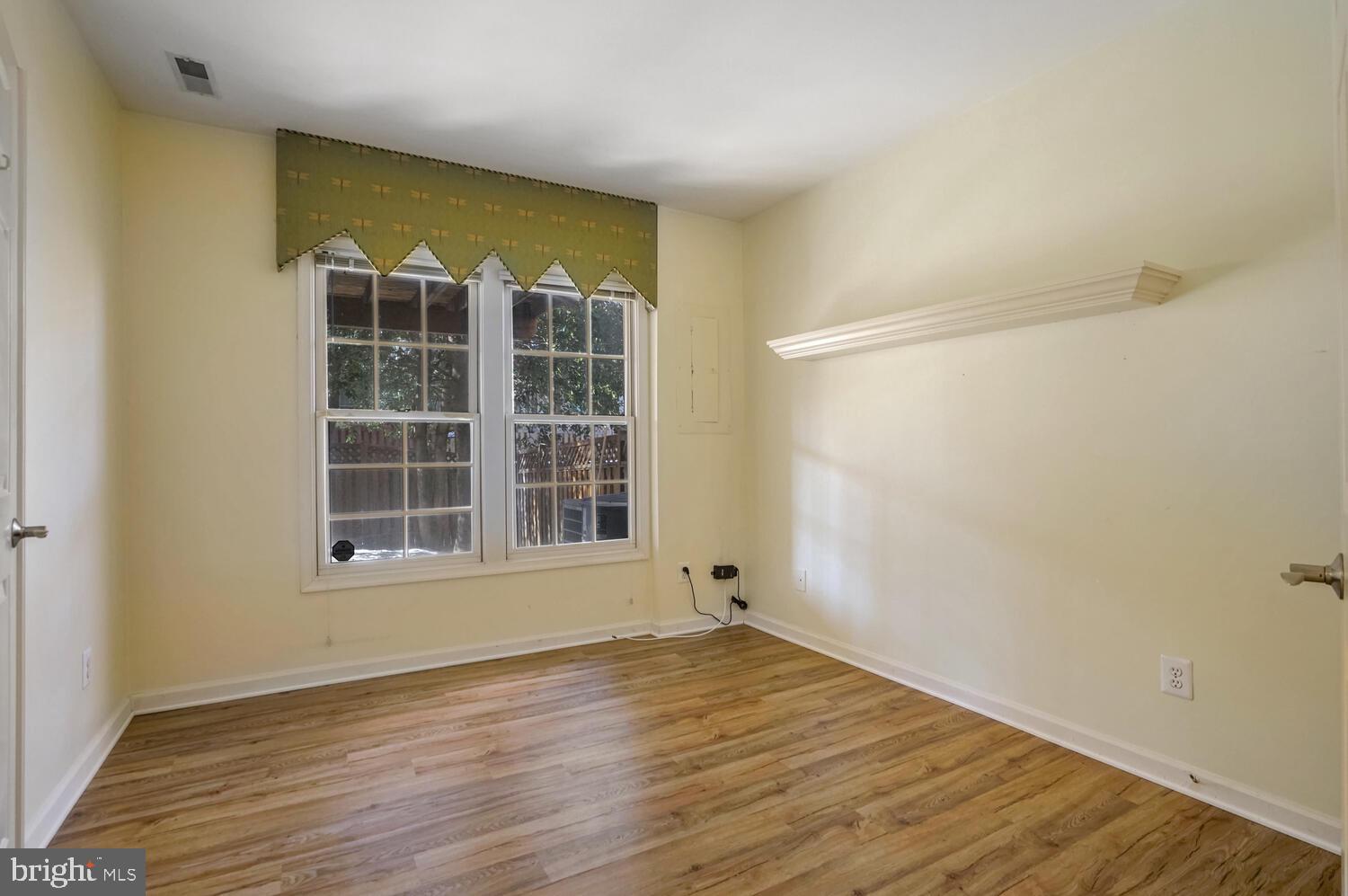 1794 Dawson Street Vienna, VA 22182 - Photo 27 of 30 an empty room with wooden floor and windows