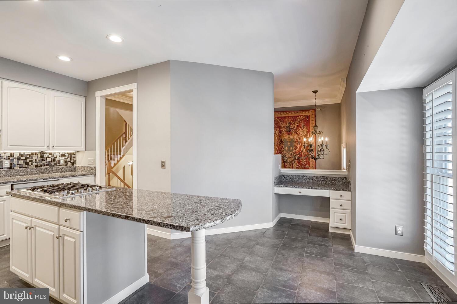 1794 Dawson Street Vienna, VA 22182 - Photo 6 of 30 a kitchen with sink cabinets and dining table