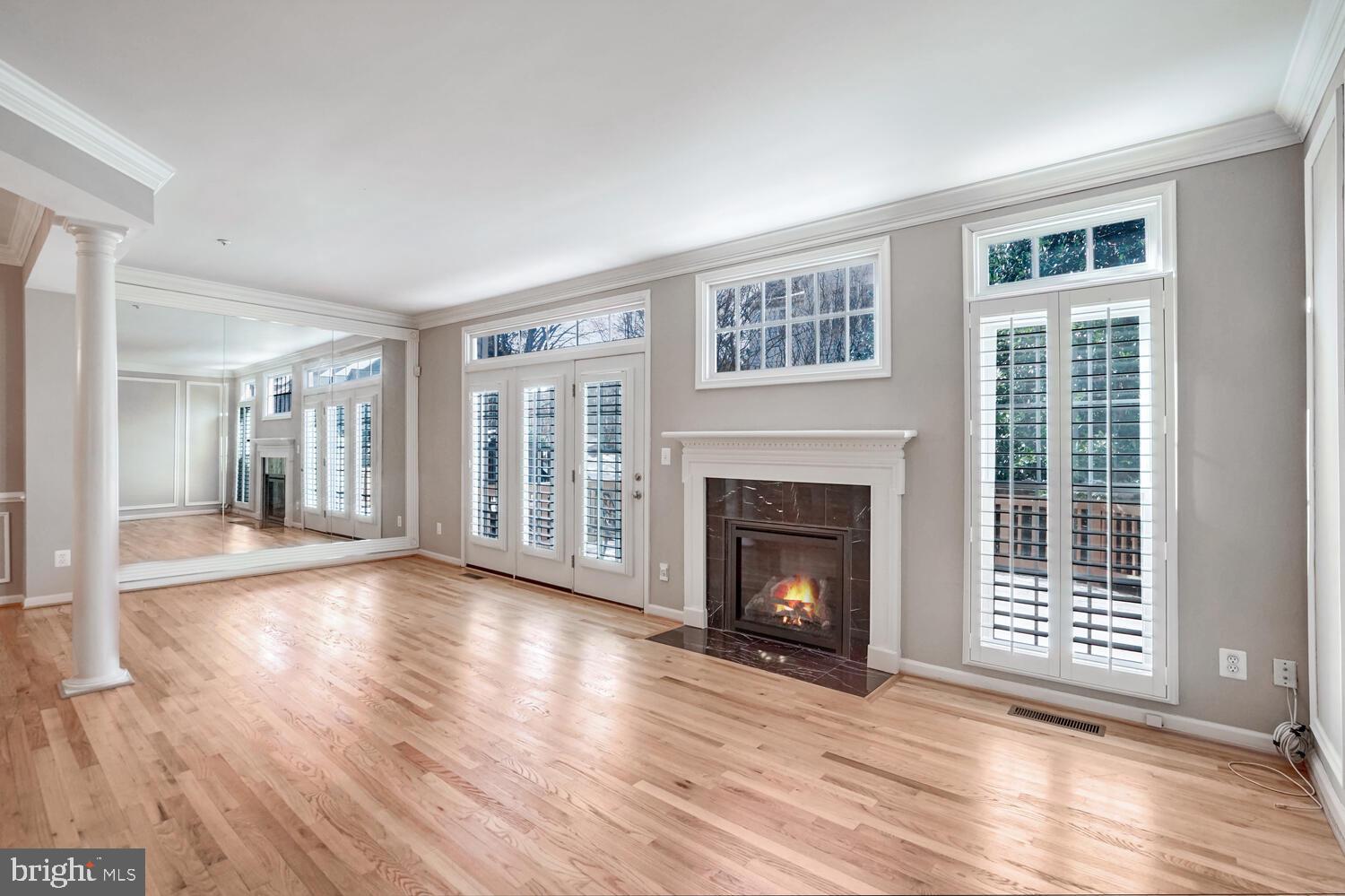 1794 Dawson Street Vienna, VA 22182 - Photo 9 of 30 a view of an empty room with wooden floor fireplace and a window