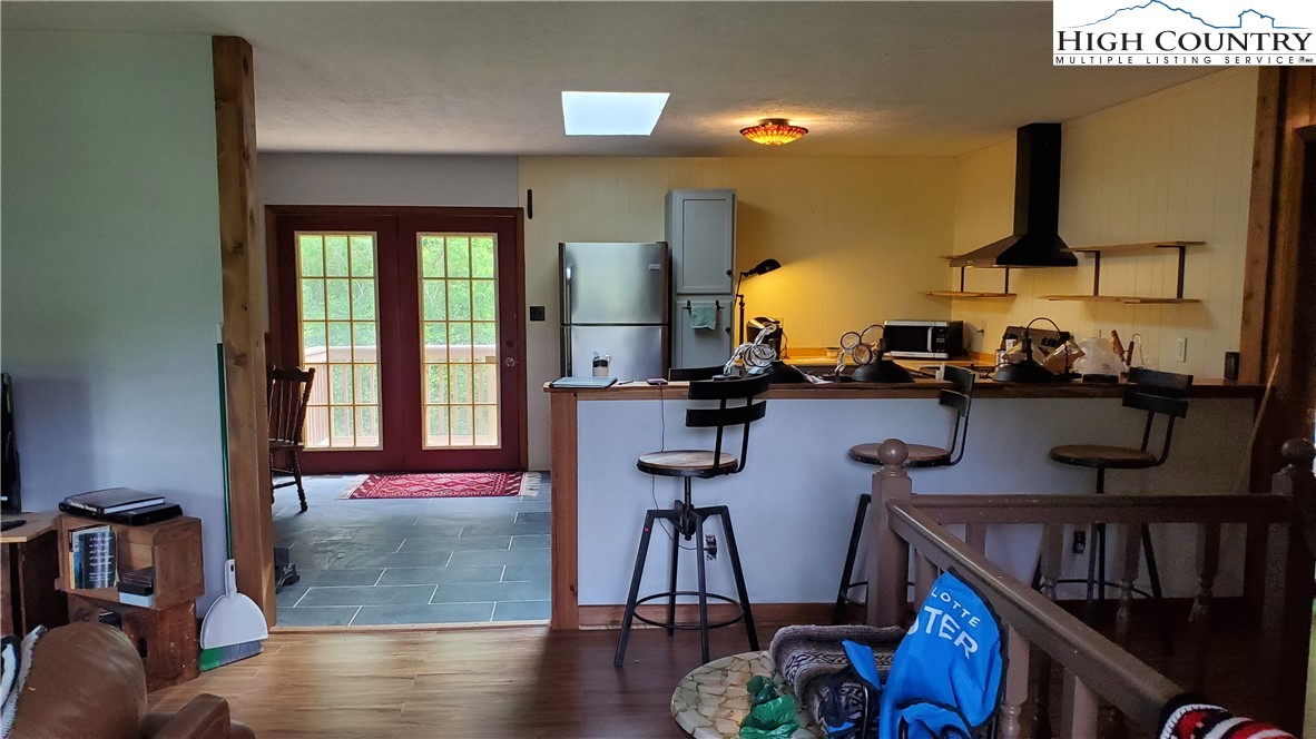 183 Clawson Road Butler, TN 37640 - Photo 3 of 13 a dining room with furniture and wooden floor