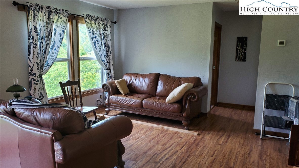 183 Clawson Road Butler, TN 37640 - Photo 4 of 13 a living room with furniture and a large window