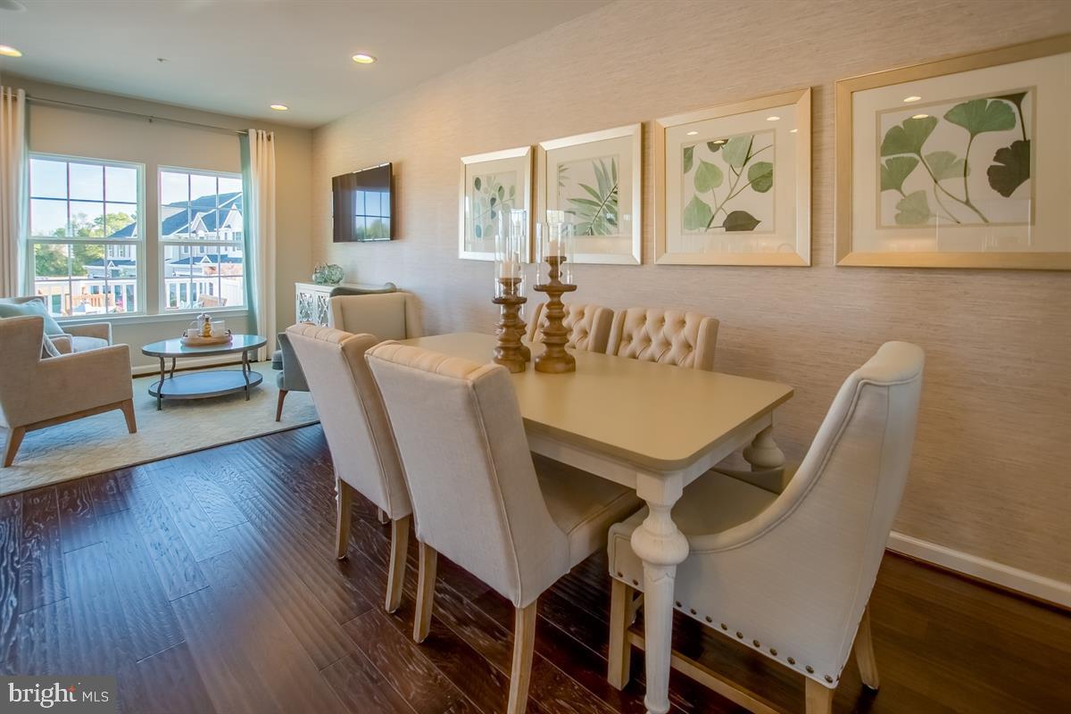 7917 Gladden Farm Way Hanover, MD 21076 - Photo 5 of 27 a view of a dining room with furniture window and wooden floor