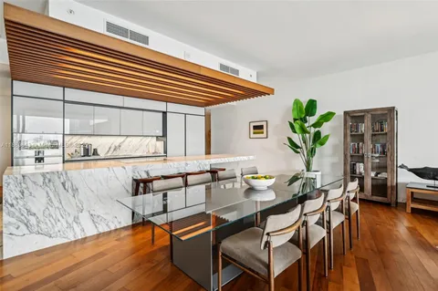 a kitchen with stainless steel appliances kitchen island granite countertop a sink and cabinets