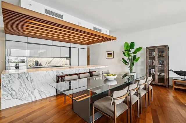 a kitchen with stainless steel appliances kitchen island granite countertop a sink and cabinets