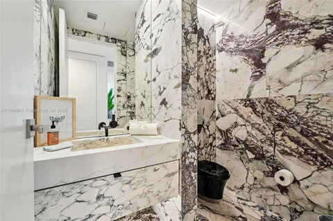 a bedroom with a large bed and a large window