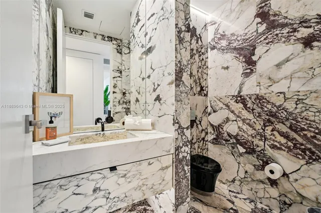 a bedroom with a large bed and a large window