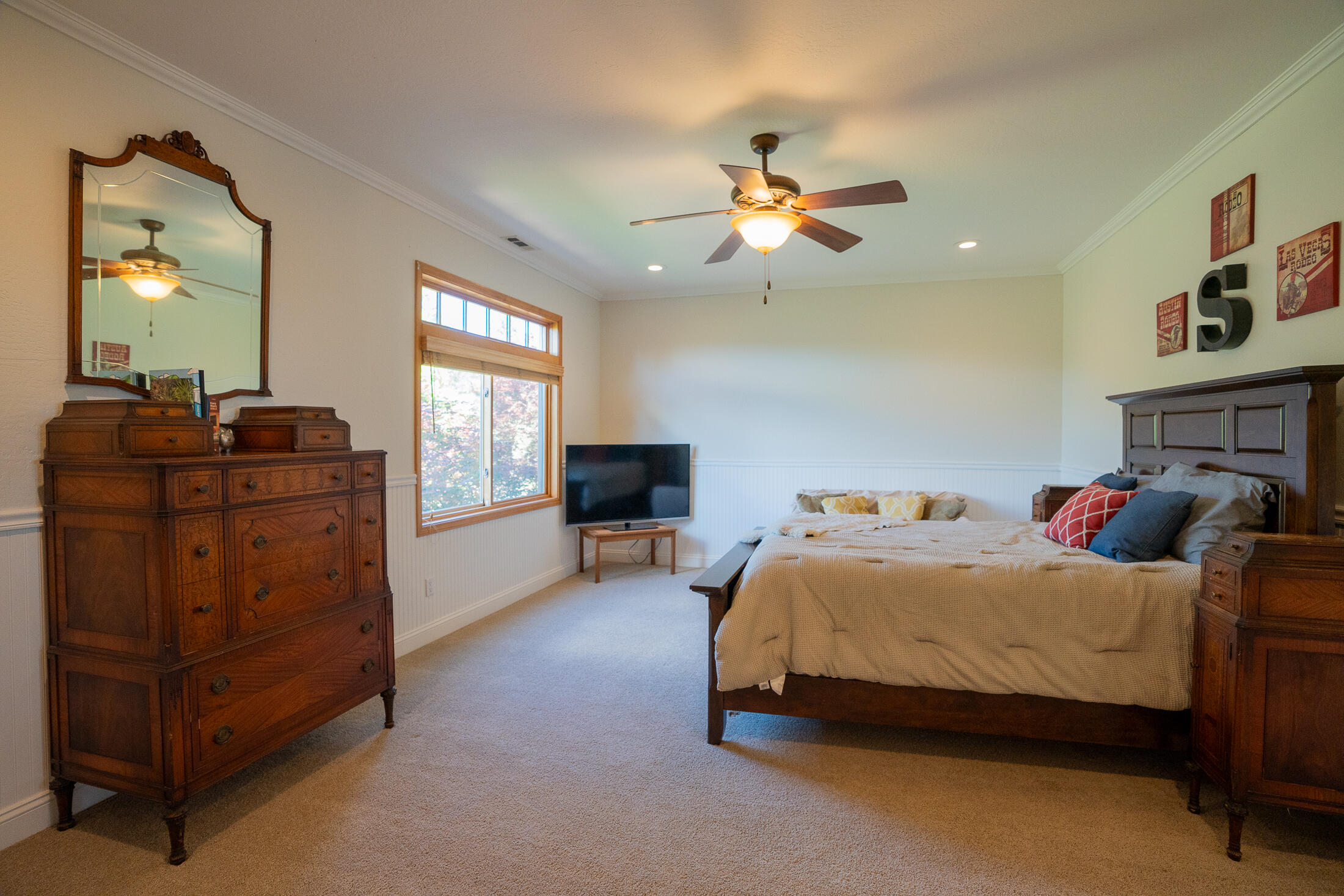 1881 Brophy Road Eagle Point, OR 97524 - Photo 68 of 130 a bedroom with a bed dresser and a window