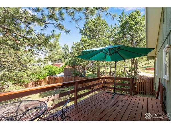 a view of balcony with furniture and wooden floor