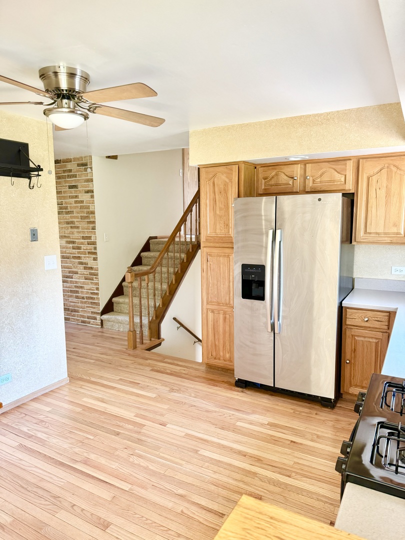 17588 West Summit Drive Grayslake, IL 60030 - Photo 4 of 19 a view of a livingroom with wooden floor and stairs