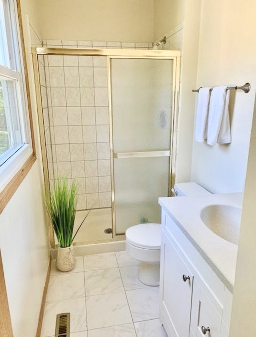 17588 West Summit Drive Grayslake, IL 60030 - Photo 7 of 19 a bathroom with a granite countertop sink a toilet and shower