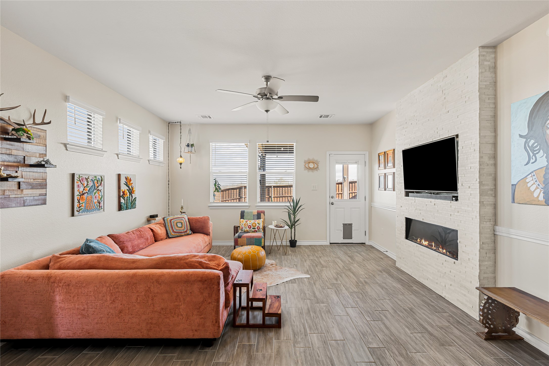 862 Pepperbark Loop Buda, TX 78610 - Photo 11 of 40 a bedroom with furniture and a flat screen tv