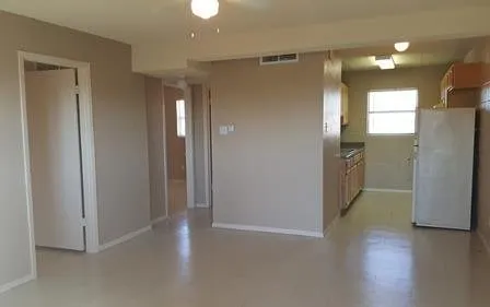 a view of entryway with cabinets and wooden floor