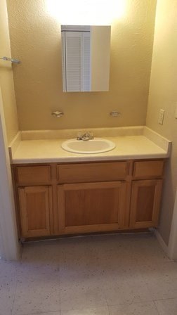 8017 San Jose Road, Unit 50 El Paso, TX 79915 - Photo 6 of 6 a bathroom with a sink and vanity