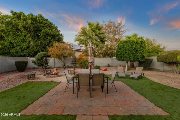 a view of a backyard with sitting area