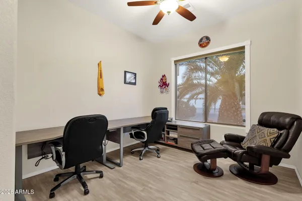 a work room with furniture and windows