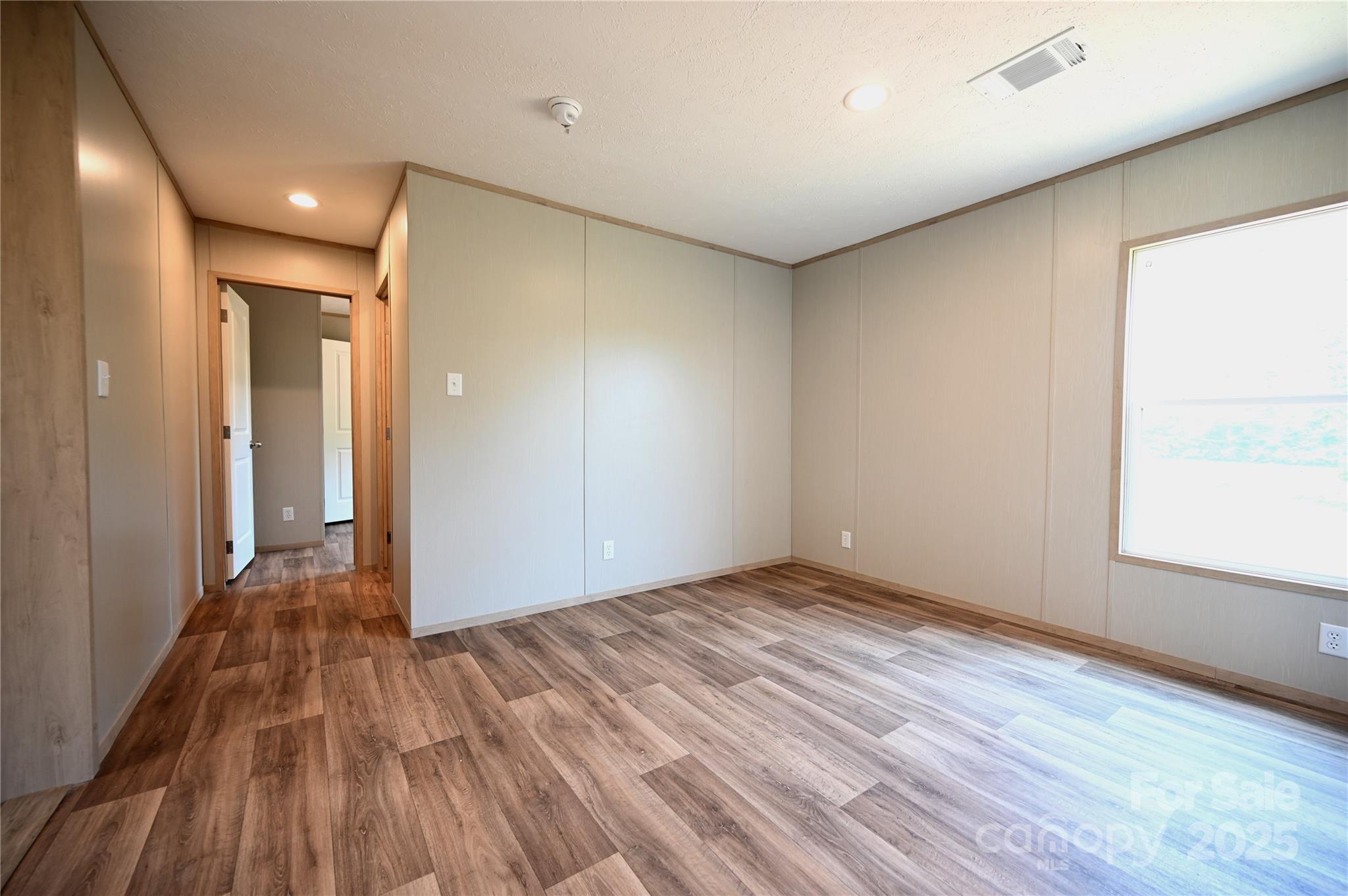 1157 Renno Road Clinton, SC 29325 - Photo 11 of 24 a view of room with window and wooden floor