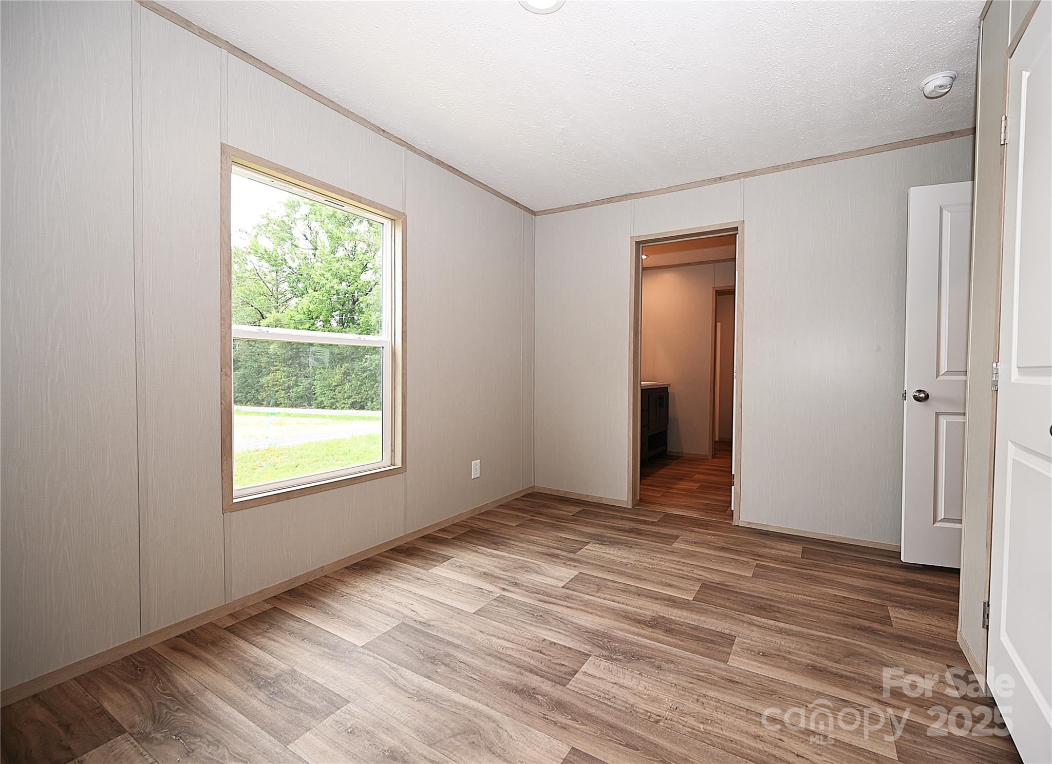 1157 Renno Road Clinton, SC 29325 - Photo 17 of 24 an empty room with windows and closet