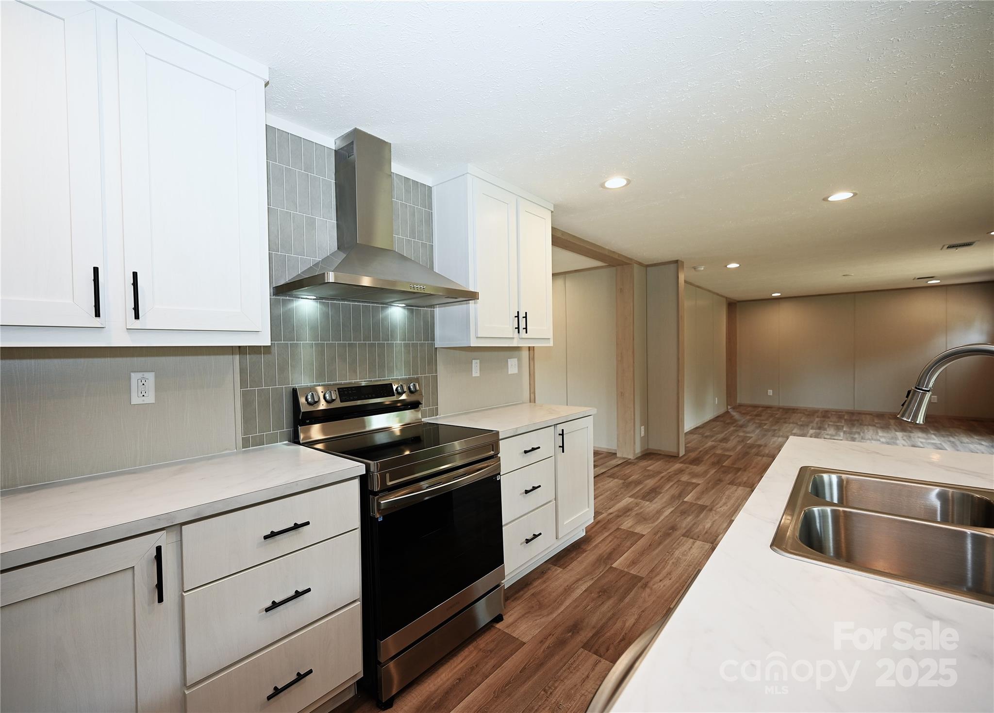 1157 Renno Road Clinton, SC 29325 - Photo 6 of 24 a kitchen with granite countertop a stove and a sink