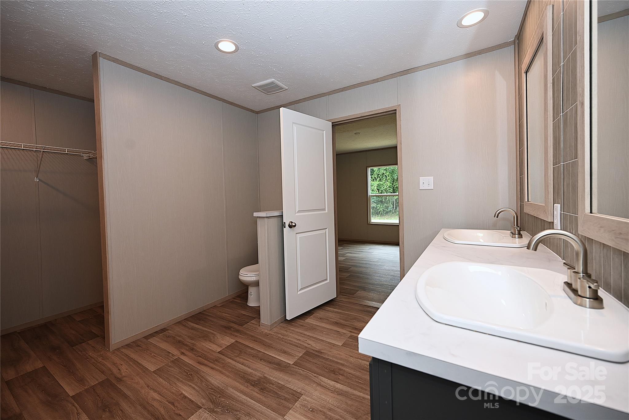 1157 Renno Road Clinton, SC 29325 - Photo 10 of 24 a bathroom with a sink and a mirror